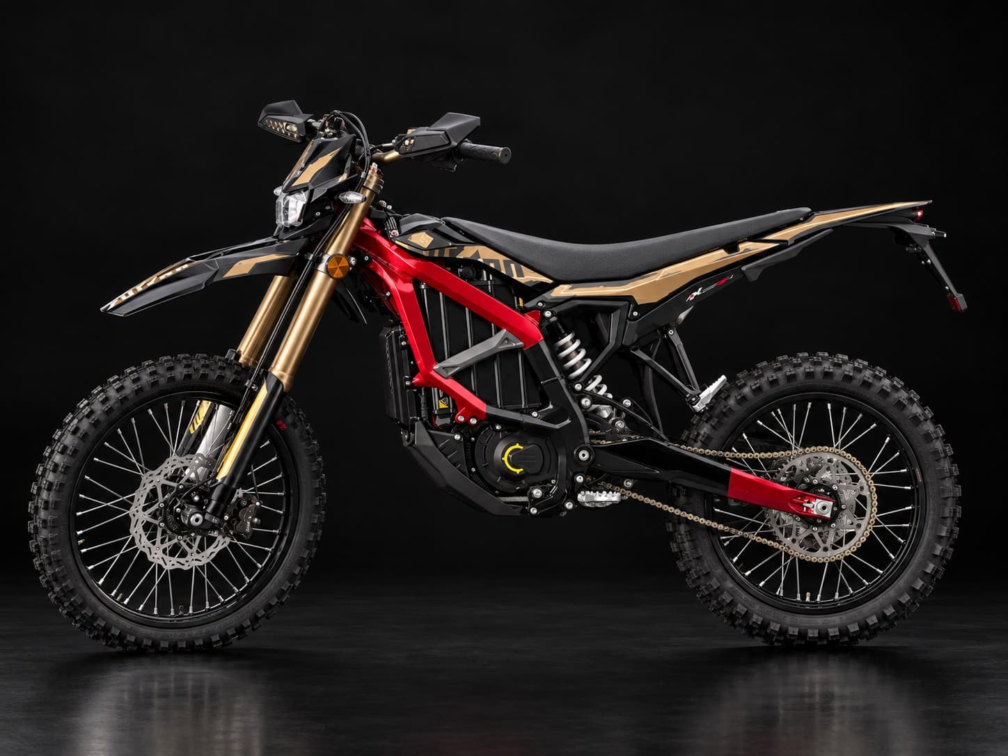 2025 Surron Ultra Bee custom, Pearl Red frame powder-coated in our shop, in a dark studio