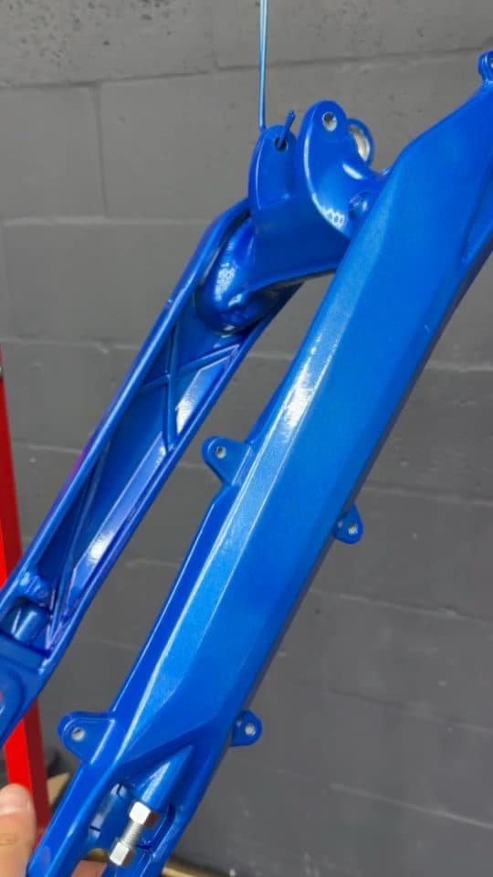 Close-up of a freshly coated candy blue frame