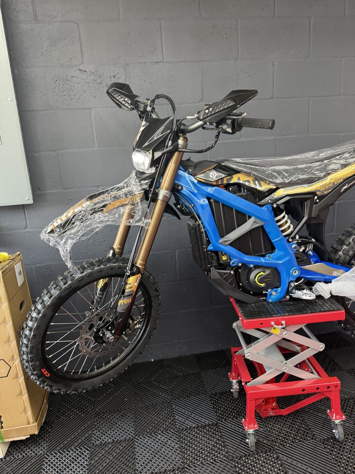 Blue Light Bee X on the lift in the shop during reassembly