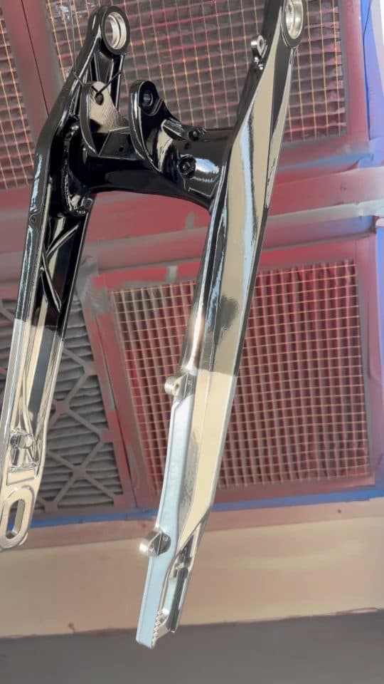 Chrome swingarm hanging in the booth
