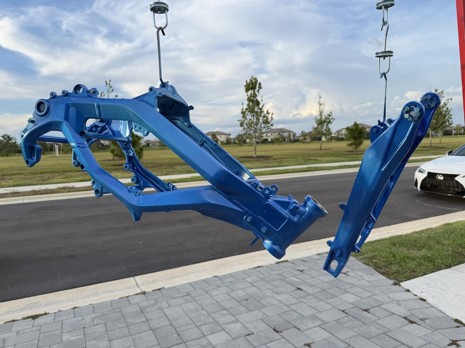 Candy blue frames hanging outside the shop after coating