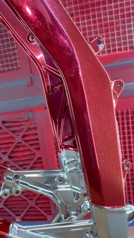 Pearl red frame with chrome parts in the booth